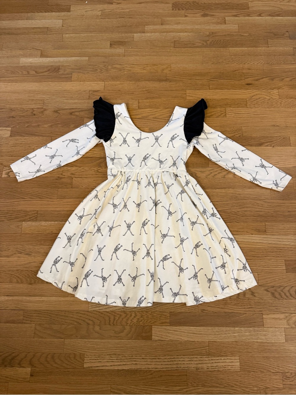 Girls Monica + Andy White Long-Sleeve Dress with Black Ruffle Shoulders skeleton